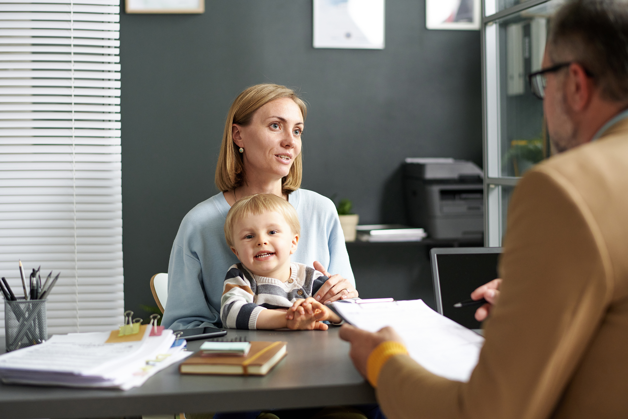 Woman with child talking to estate planner